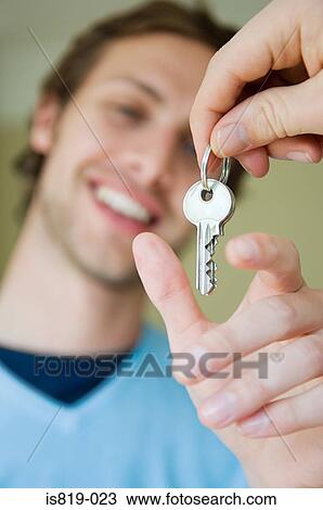 Man taking keys View Large Photo Image Stock Image - Man taking keys. Fotosearch