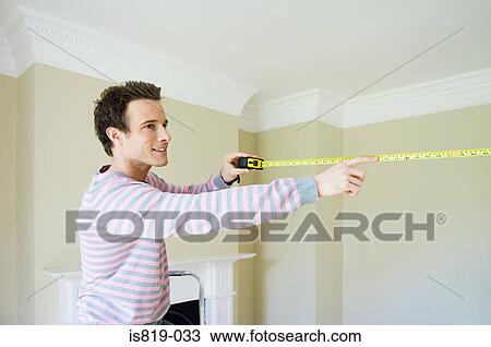 Man with tape measure View Large Photo Image Stock Image - Man with tape measure. Fotosearch