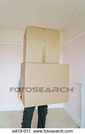 Person holding cardboard boxes View Large Photo Image Stock Image - Person holding cardboard boxes. Fotosearch