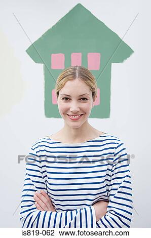 Woman in front of painted house View Large Photo Image Stock Image - Woman in front of painted house. Fotosearch
