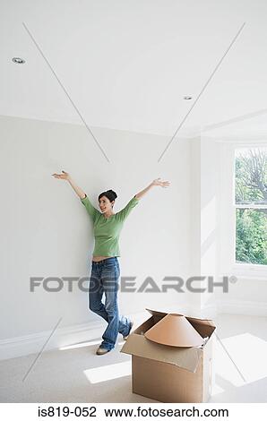 Woman in her new house View Large Photo Image Stock Image - Woman in her new house. Fotosearch