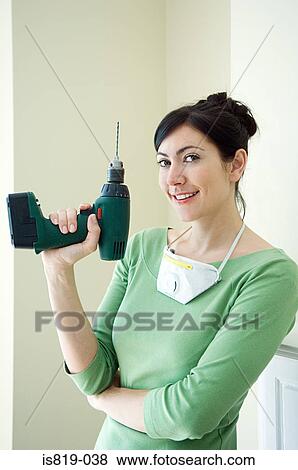 Woman with a power drill View Large Photo Image Stock Photo - Woman with a power drill. Fotosearch