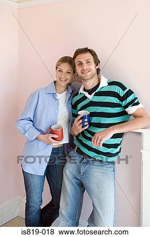 Young couple with coffee cups View Large Photo Image Stock Photo - Young couple with coffee cups. Fotosearch