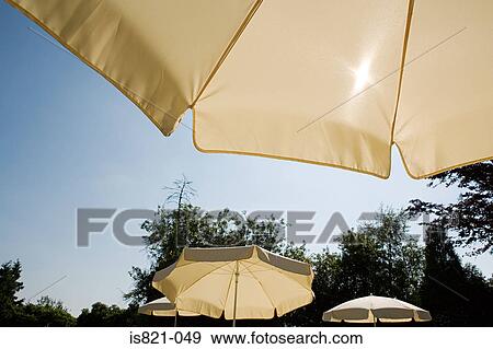 Parasols on a sunny day View Large Photo Image Stock Photo - Parasols on a sunny day. Fotosearch