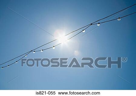 Sunlight through a row of lightbulbs View Large Photo Image Stock Photography - Sunlight through a row of lightbulbs. Fotosearch