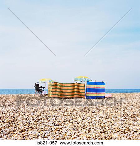 Windbreakers on a beach View Large Photo Image Stock Photo - Windbreakers on a beach. Fotosearch