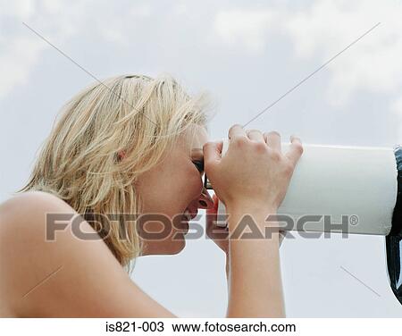 Woman looking through telescope View Large Photo Image Stock Image - Woman looking through telescope. Fotosearch