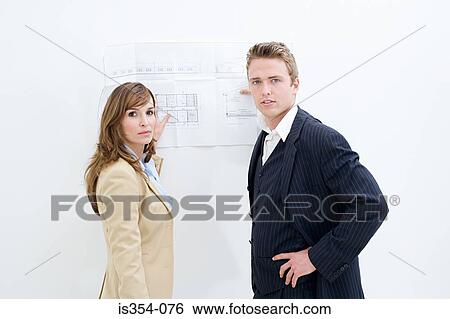 Architects with a plan View Large Photo Image Stock Photograph - Architects with a plan. Fotosearch