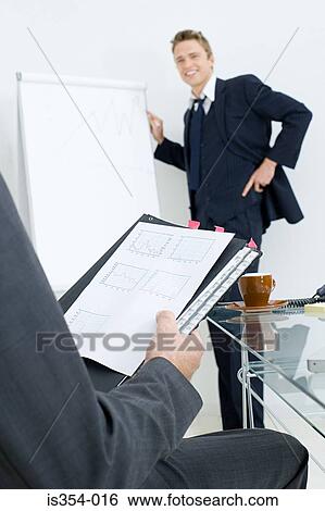 Businessman giving presentation View Large Photo Image Stock Photograph - Businessman giving presentation. Fotosearch