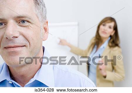 Stock Photo - Man ignoring businesswoman. Fotosearch
