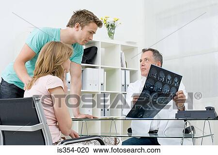 Patient with doctor and boyfriend View Large Photo Image Stock Image - Patient with doctor and boyfriend. Fotosearch