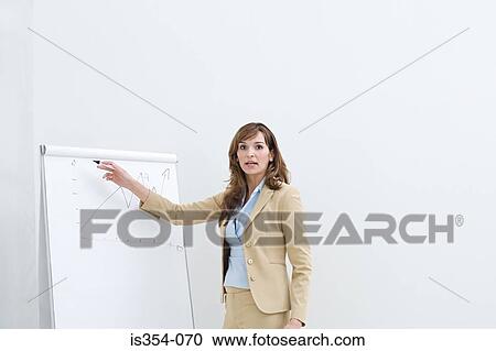 Stock Image - Woman giving presentation. Fotosearch