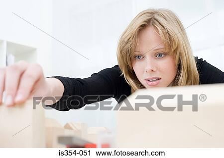 Woman preparing fashion model View Large Photo Image Stock Image - Woman preparing fashion model. Fotosearch