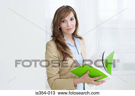 Stock Image - Woman with a brochure. Fotosearch