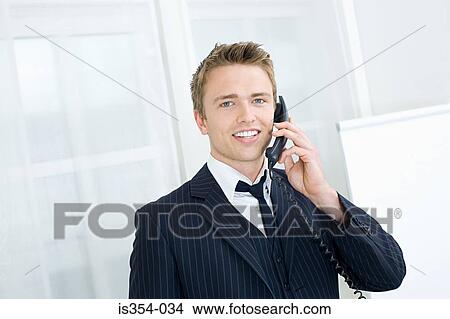 Young businessman on the telephone View Large Photo Image Picture - Young businessman on the telephone. Fotosearch