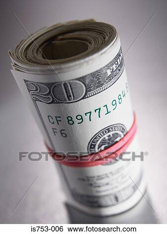 Banknotes rolled in a rubber band View Large Photo Image Stock Photograph - Banknotes rolled in a rubber band. Fotosearch