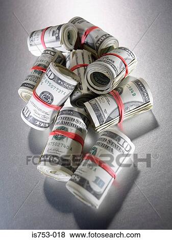 Stock Photo - Pile of banknote rolls. Fotosearch