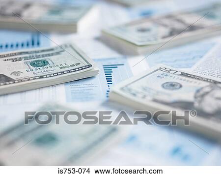 Piles of twenty dollar notes on paperwork View Large Photo Image Picture - Piles of twenty dollar notes on paperwork. Fotosearch