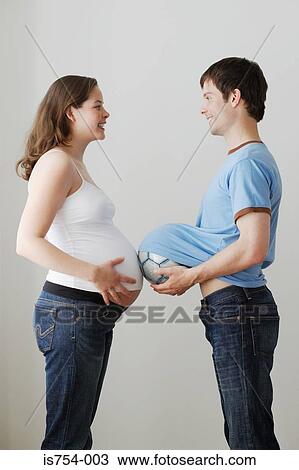 Stock Image - Pregnant woman and partner. Fotosearch