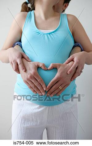 Pregnant woman and partner View Large Photo Image Stock Photography - Pregnant woman and partner. Fotosearch