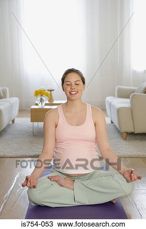 Pregnant woman practising yoga View Large Photo Image Stock Image - Pregnant woman practising yoga. Fotosearch
