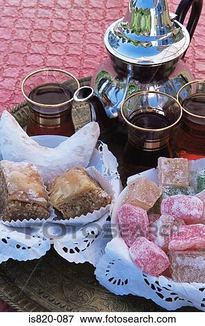 Baklava turkish delight kaab el ghzal and mint tea View Large Photo Image Stock Photo - Baklava turkish delight kaab el ghzal and mint tea. Fotosearch