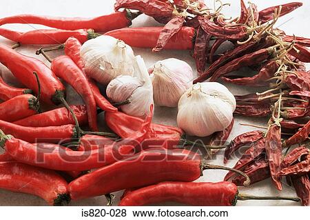 Chilli peppers and garlic View Large Photo Image Stock Photo - Chilli peppers and garlic. Fotosearch