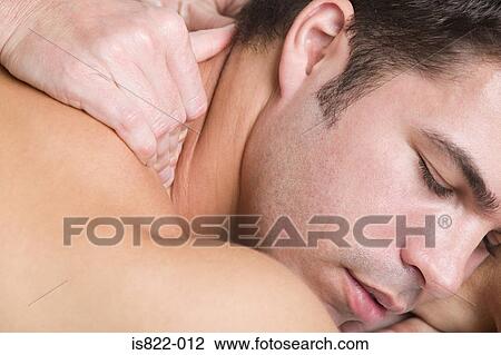 Stock Image - Man being massaged. Fotosearch