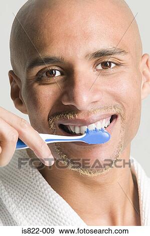 Man brushing his teeth View Large Photo Image Stock Photo - Man brushing his teeth. Fotosearch