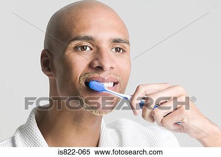 Man brushing his teeth View Large Photo Image Stock Photography - Man brushing his teeth. Fotosearch