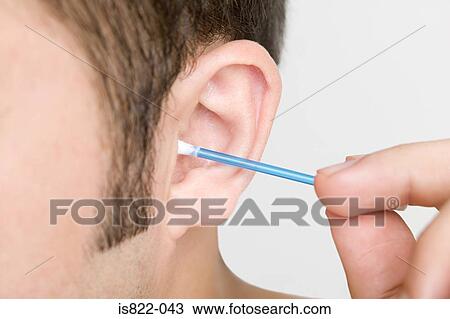 Man cleaning his ear View Large Photo Image Stock Image - Man cleaning his ear. Fotosearch