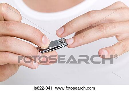 Man clipping his finger nails View Large Photo Image Stock Image - Man clipping his finger nails. Fotosearch
