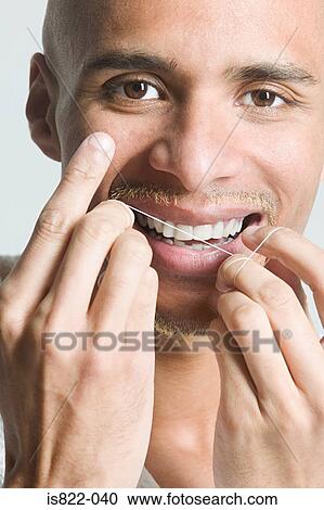Man flossing his teeth View Large Photo Image Stock Image - Man flossing his teeth. Fotosearch