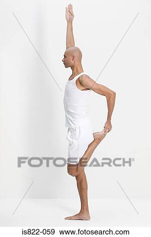 Stock Photo - Man in a yoga pose. Fotosearch