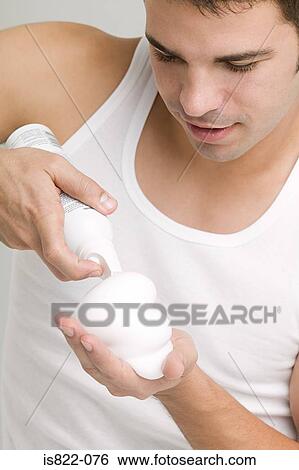 Man squirting hair mousse View Large Photo Image Stock Photograph - Man squirting hair mousse. Fotosearch
