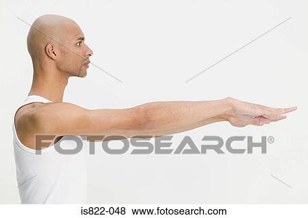 Man stretching his arms out View Large Photo Image Stock Photo - Man stretching his arms out. Fotosearch