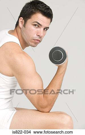 Picture - Man with a dumbbell. Fotosearch