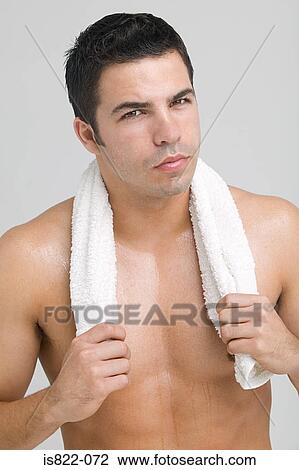 Young man with a towel View Large Photo Image Stock Image - Young man with a towel. Fotosearch