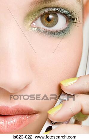 Woman using a cellular telephone View Large Photo Image Stock Image - Woman using a cellular telephone. Fotosearch