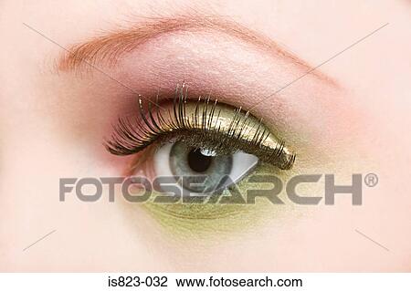 Stock Image - Woman wearing eyeshadow. Fotosearch
