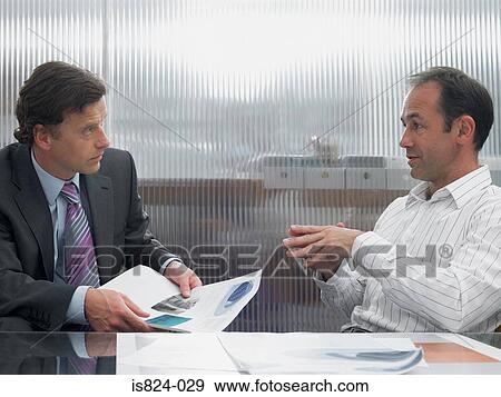 Stock Photo - Buisnessmen in discussion. Fotosearch
