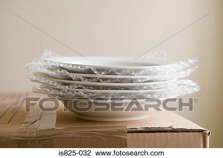 Stock Image - Bowls ready for packing. Fotosearch
