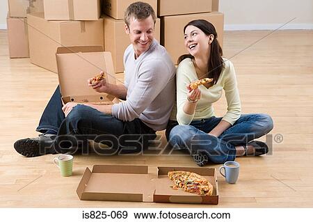 Couple having pizza View Large Photo Image Stock Photo - Couple having pizza. Fotosearch