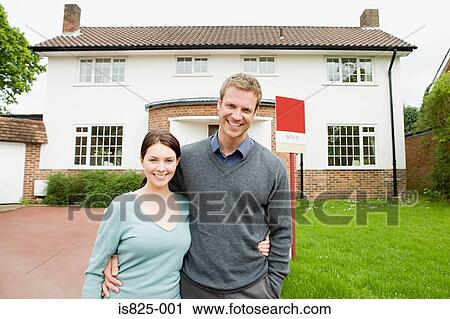 Couple outside their new house View Large Photo Image Stock Image - Couple outside their new house. Fotosearch