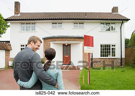 Couple outside their new house View Large Photo Image Stock Image - Couple outside their new house. Fotosearch