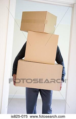 Man carrying cardboard boxes View Large Photo Image Stock Photography - Man carrying cardboard boxes. Fotosearch