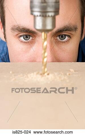 Man drilling View Large Photo Image Picture - Man drilling. Fotosearch