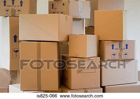 Stack of cardboard boxes in a room View Large Photo Image Stock Photograph - Stack of cardboard boxes in a room. Fotosearch