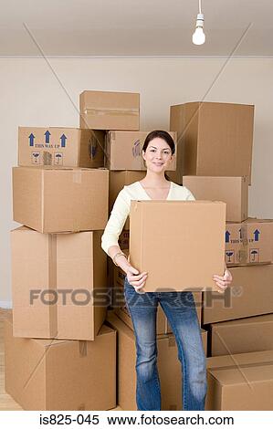 Woman with cardboard box View Large Photo Image Stock Photography - Woman with cardboard box. Fotosearch