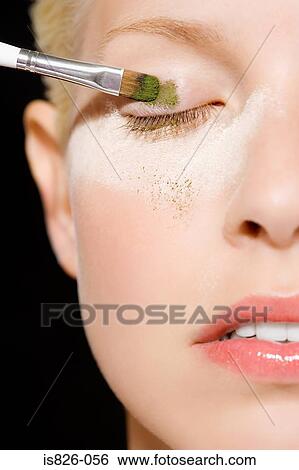 Applying green eyeshadow View Large Photo Image Stock Photograph - Applying green eyeshadow. Fotosearch